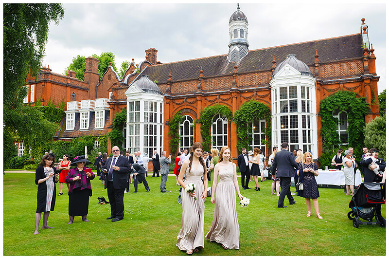Newnham College Cambridge wedding guests on the lawn