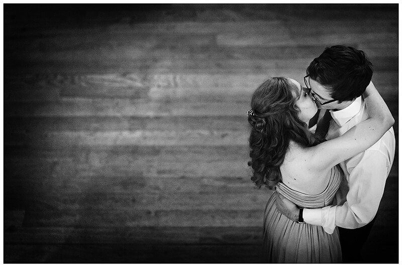 couple kiss on dance floor Newnham College Cambridge wedding reception