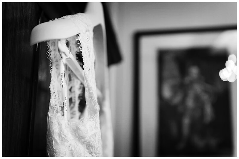 top of brides dress on hanger during getting ready at Trinity College wedding