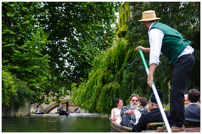 Wedding guests riding along the river cam in punts