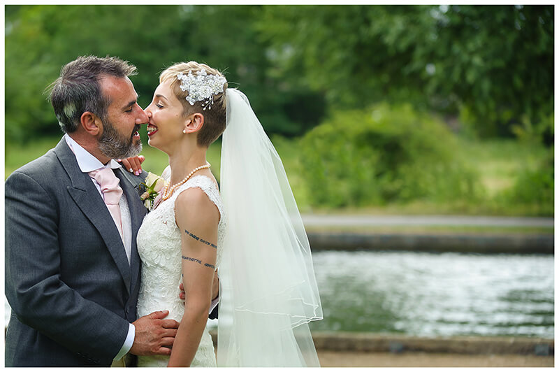 bride groom kiss in gardens of Cambridge Doubletree by Hilton Hotel Wedding 