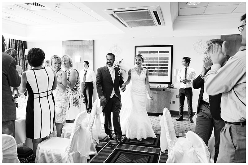 bride groom enter dining room at Cambridge Doubletree by Hilton Hotel wedding reception