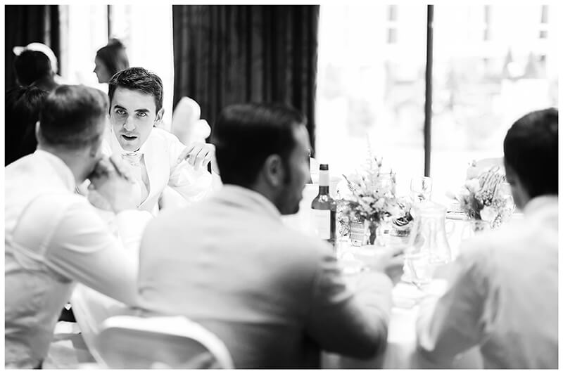 wedding guests in conversation at dining table
