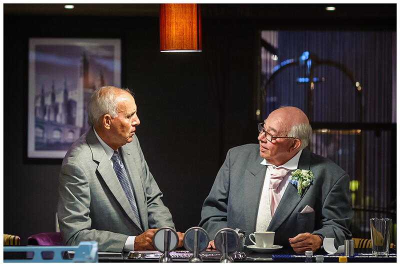two older gents talking at bar in Cambridge Doubletree by Hilton Hotel