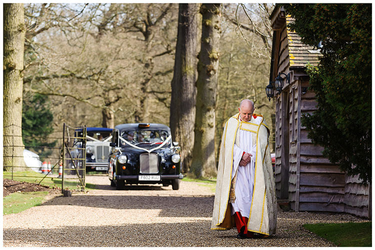 Royal Chapel Windsor Great Park vicar leading the way as bridal cars arrive