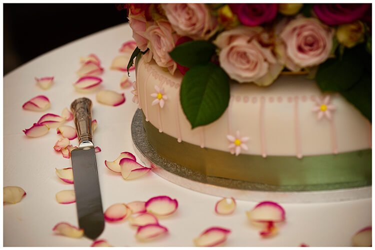 hengrave hall wedding cake rose petals knife