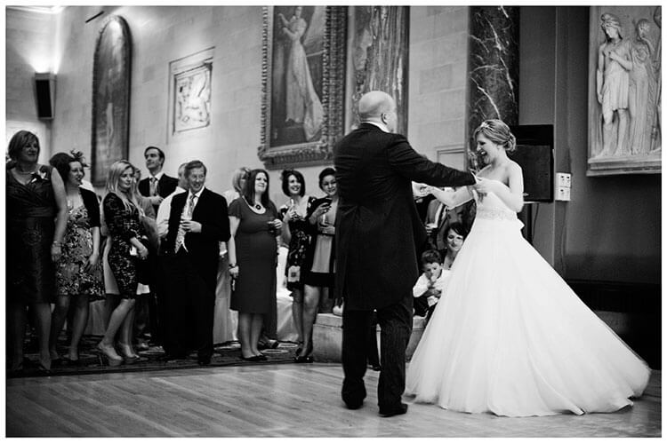 bride groom first dance watched by guests
