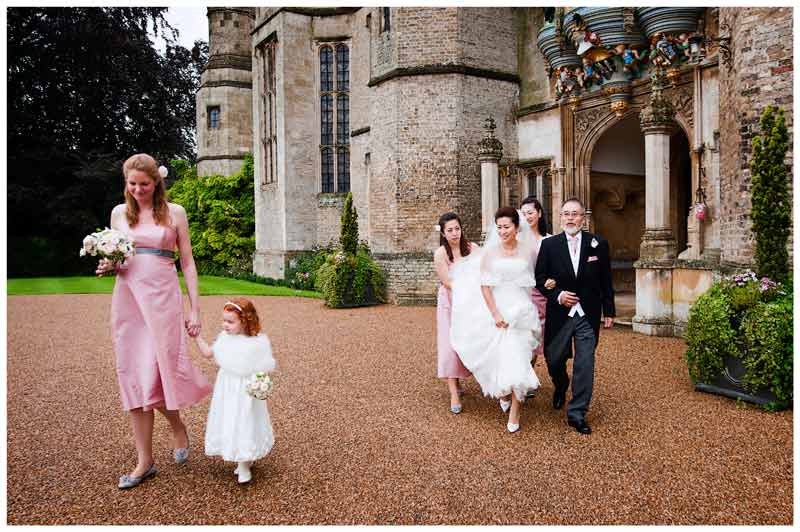 bridal party leaves hengrave hall to go to church