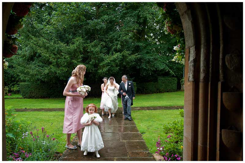 bridal party arriving at the Hengrave Hall church