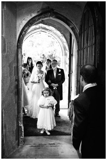 Bride entering Hengrave Hall church