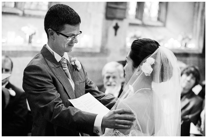 groom holds bride during her vows
