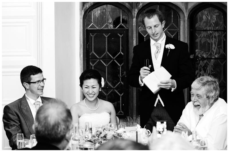 bride & groom laugh during best mans speech