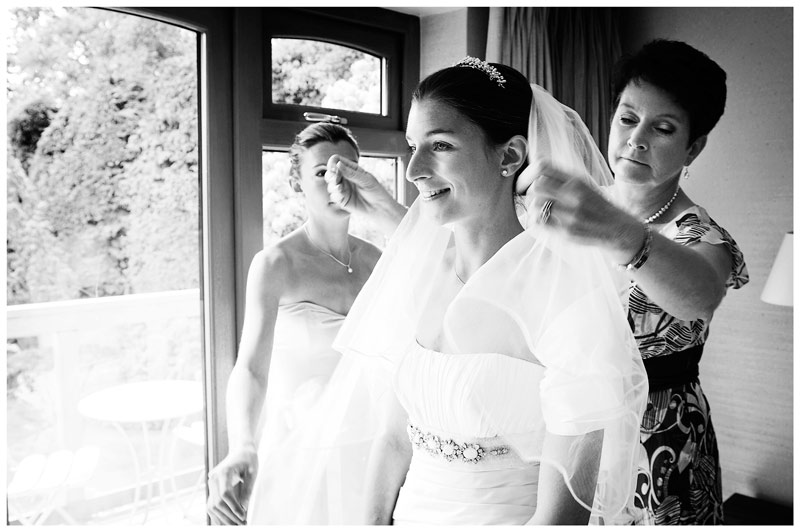 brides mother adjusting veil