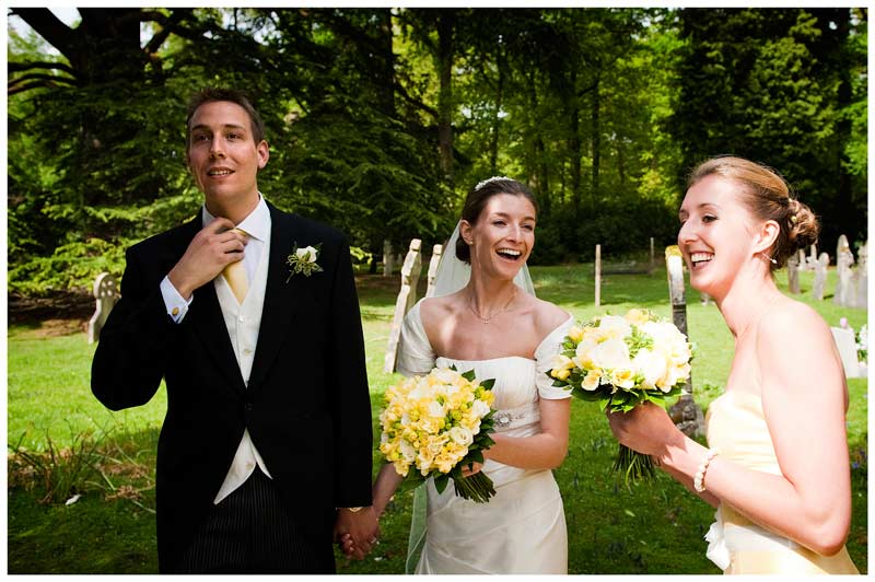 bride groom bridesmaids laughing