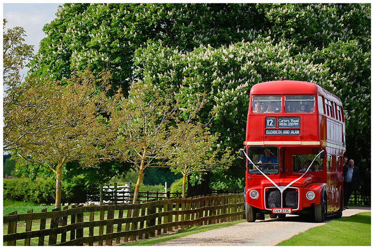 Snelson Farm wedding guests red double decker bus arrives