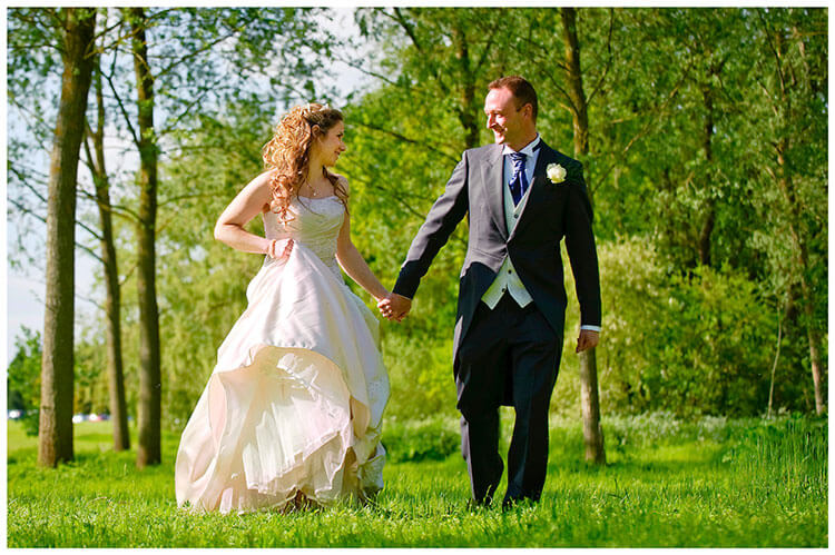 Snelson Farm wedding bride groom walking in wood