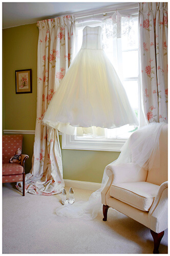 Leicestershire Kirby Muxloe wedding dress hanging from curtain rail