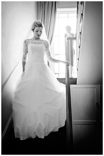 Leicestershire Kirby Muxloe wedding bride comes down stairs