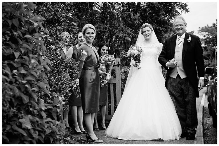 Leicestershire Kirby Muxloe wedding bridal party hurry on late guests