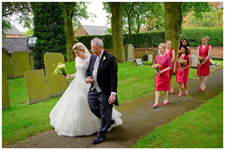 Leicestershire Kirby Muxloe wedding bridal party walking along path