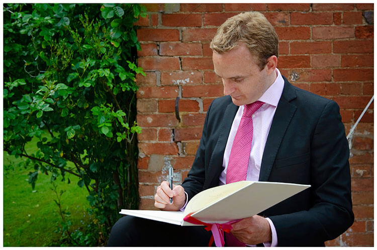 Leicestershire Kirby Muxloe wedding signing the guest book