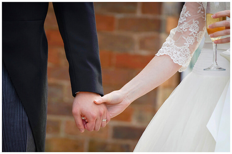Leicestershire Kirby Muxloe wedding holding hands