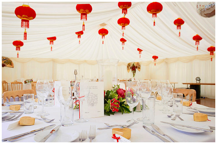 Leicestershire Kirby Muxloe wedding marquee interior decorated with red lanterns