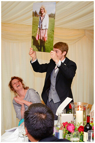 Leicestershire Kirby Muxloe wedding speech holding up photo of groom in ladies clothing