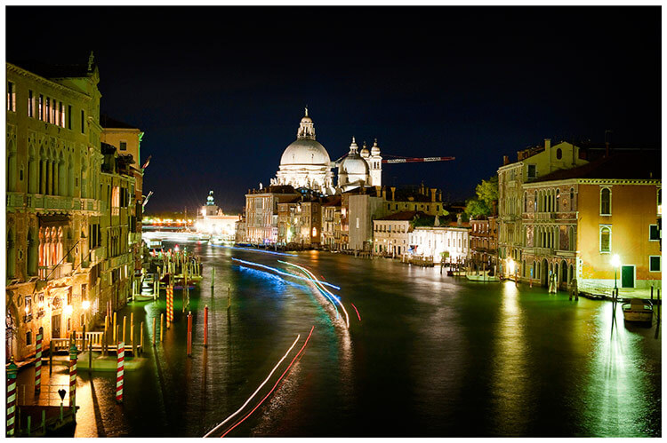 Venice Canal at night light stream from boats
