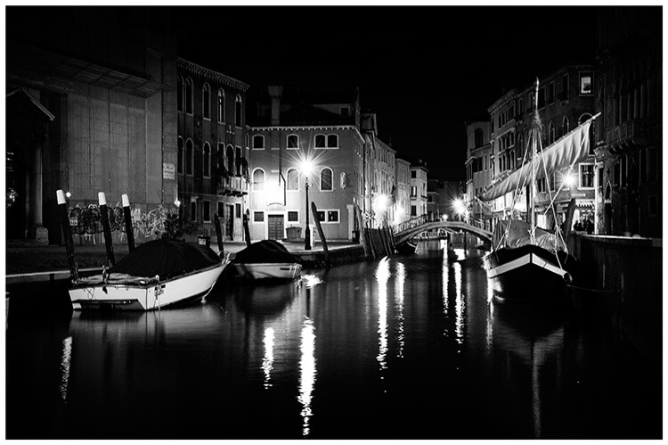 Venice boats on the canal at night