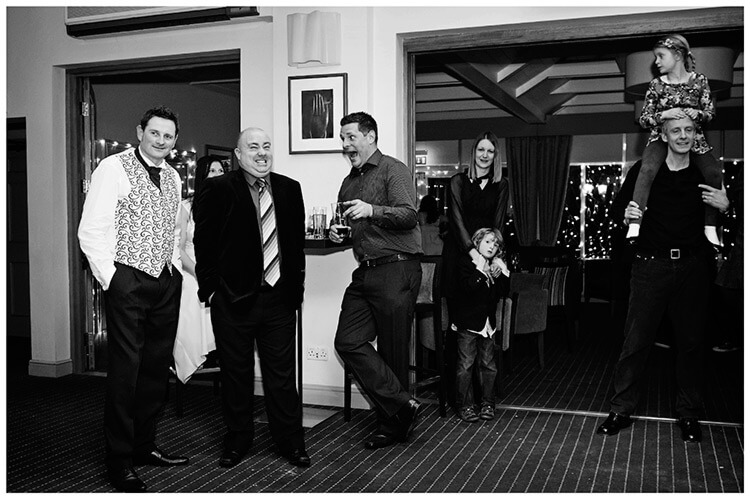 Quy Mill Hotel wedding photography guests in bar