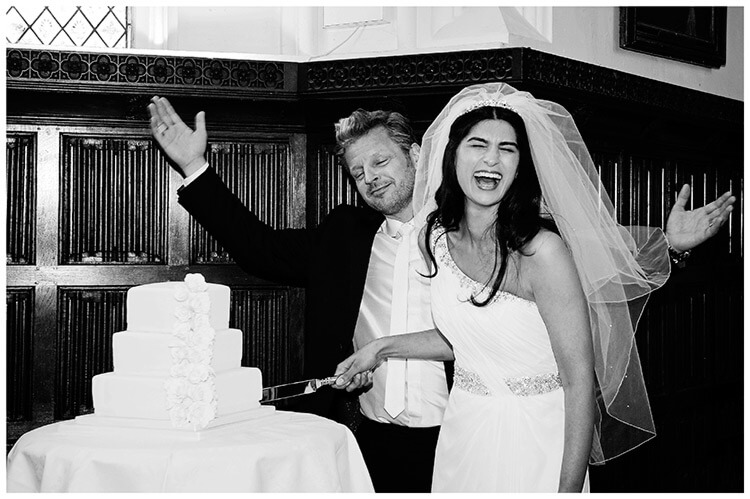 Christ’s College wedding bride laughs during cake cutting