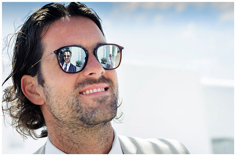 groom reflected in sunglasses of guy at Andronikos Boutique Hotel Mykonos