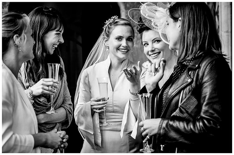 Bride and female friends enjoying a laugh favourite wedding photography 2018